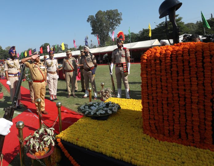 IGP Jammu Anand Jain giving salute at the Police Martyr Memorial on Police Commemoration Day on Saturday. -Excelsior/Rakesh