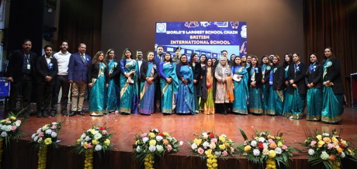 Dignitaries and School Management of British International School posing for group photograph during Annual Day event.