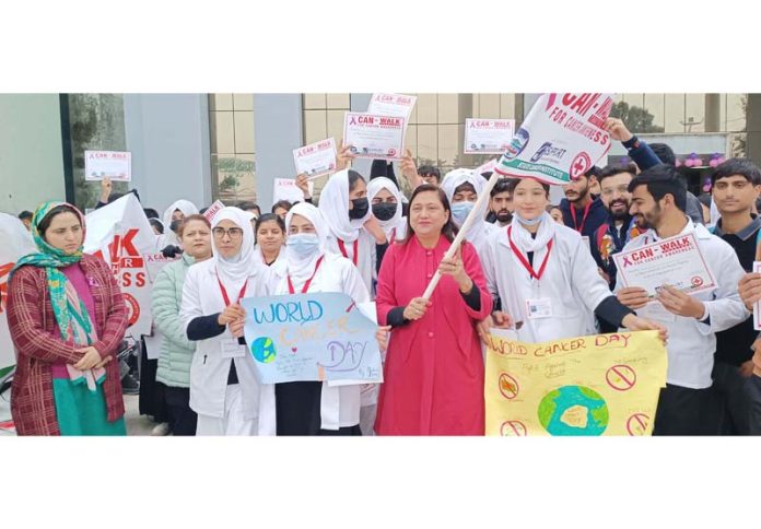 Students of AMT School (GMC Jammu) and volunteers of NGO Support taking out cancer awareness walk from SCI Jammu on Saturday.