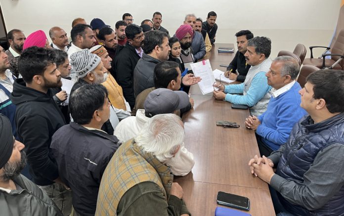 MP, Jugal Kishore Sharma and former MLA, Ashwani Sharma listening public grievances at BJP office on Saturday.