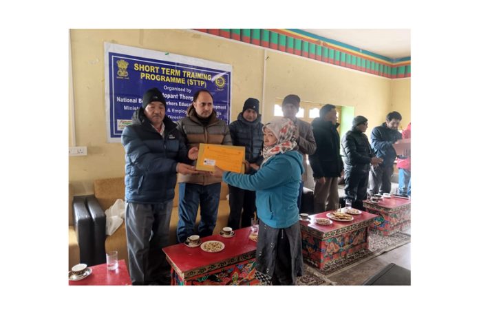 Kamal Kishore Soan, Joint Secretary, Union Ministry of Labour and Employment, handing over certificate to the participants during a programme organised on Saturday.