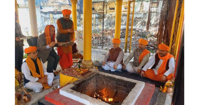 Members of Dharmarth Trust performing hawan to celebrate birthday of Dr Karan Singh in Jammu on Saturday.