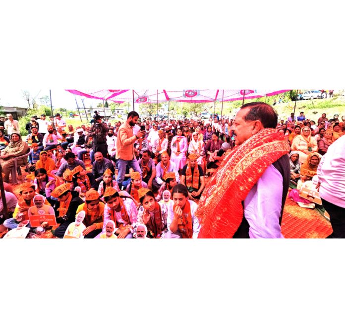 Union Minister Dr. Jitendra Singh addressing a massive public rally in a suburb Panchayat area of Udhampur on Saturday.