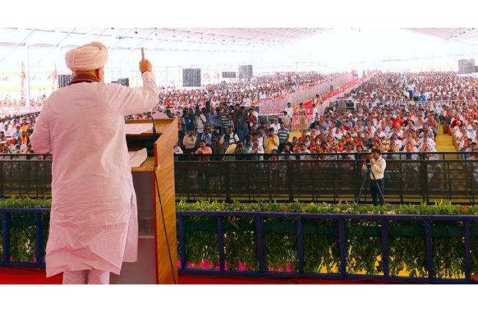 Union Minister for Home Amit Shah addressing an election rally in Porbandar, Gujarat on Saturday. (UNI)