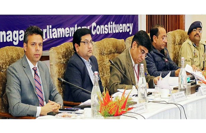 Observers chairing a meeting at Srinagar.