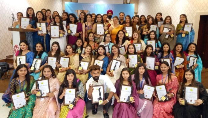 Winners posing for a group photograph during an event on Saturday.