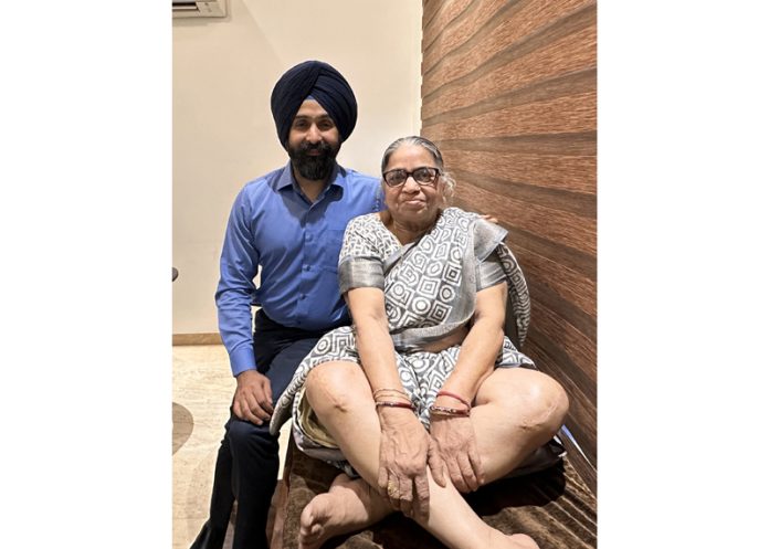 Dr Ranjit Singh posing with a patient on whom he performed knee replacement surgery.