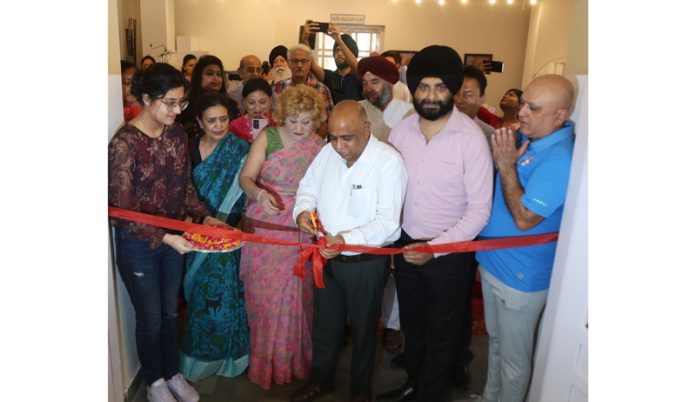 Principal Secretary, Culture and Tribal Affairs, Suresh Kumar Gupta inaugurating a photo exhibition at Kala Kendra, Jammu. -Excelsior/Rakesh