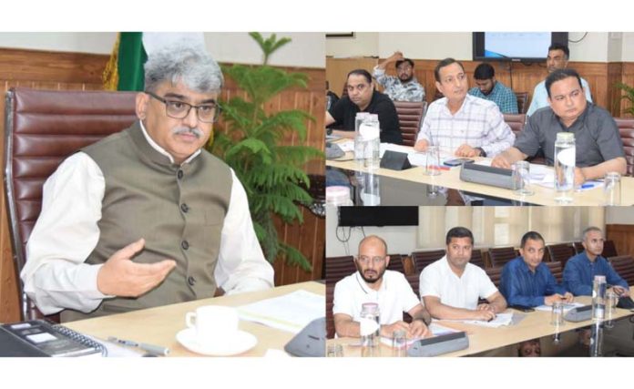 Chief Secretary Atal Dullo chairing a meeting.