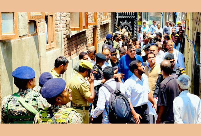 Dr Farooq Abdullah visiting the site of Bohri Kadal Bazar Masjid fire.