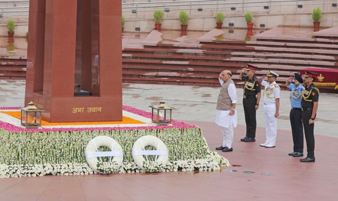 Defence Minister Rajnath Singh paying homage to the bravehearts at the National War Memorial on the occasion of 25th anniversary of India’s victory in the Kargil war in New Delhi on Friday.UNI