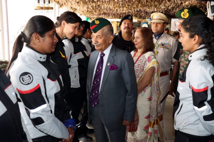 LG Ladakh Brig (Retd) B D Mishra interacting with women bike rally participants at Leh on Thursday.