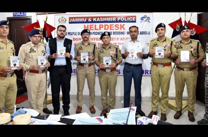 ADGP Jammu, Anand Jain, along with other civil and police officers, during the inauguration of the Overseas Helpdesk and Anti-Drug Helpline at DPL Poonch on Monday.