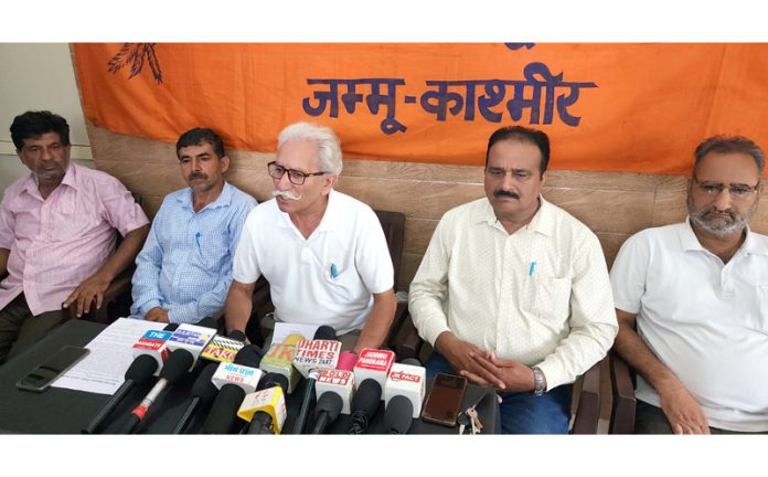 Bhartiya Mazdoor Sangh leaders addressing a press conference at Jammu on Wednesday. -Excelsior/Rakesh