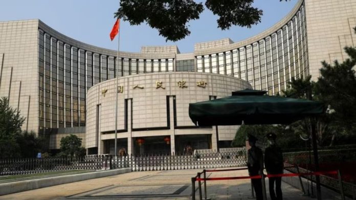 China's central bank cuts interest rates, moving to put more pep into the economy