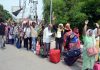 Shri Amarnath Ji bound pilgrims waiting in a queue to enter Bhagwati Nagar Yatri Niwas on Wednesday. —Excelsior/Rakesh