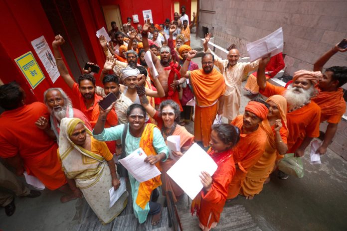 Sadhus waiting for registration at Ram Mandir, Jammu on Friday. —Excelsior/Rakesh