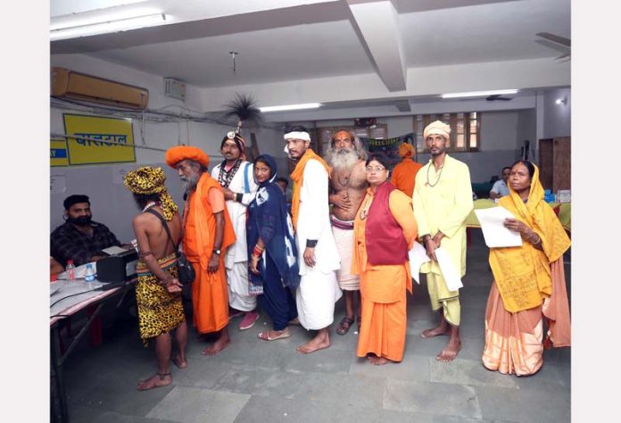 Sadhus at a registration camp at Jammu on Monday. -Excelsior/Rakesh