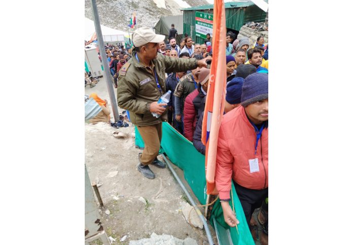 Yatris waiting in long queues at holy cave for darshan on Wednesday.