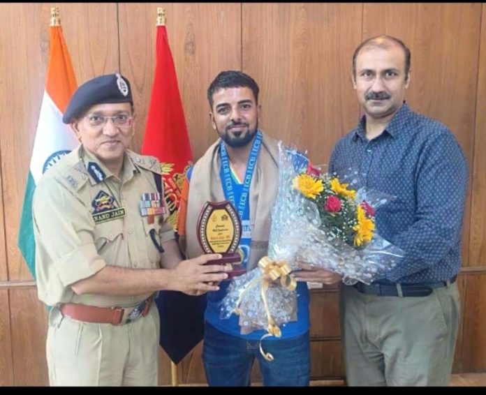 ADGP Jammu Zone Anand Jain and Ranjeet Kalra (Member, J&K Sports Council) honouring Indian deaf cricketer from J&K Umar Ashraf.