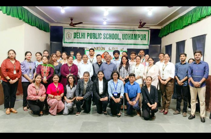 Students posing along with dignitaries during Unison 6.0 fest at DPS Udhampur.