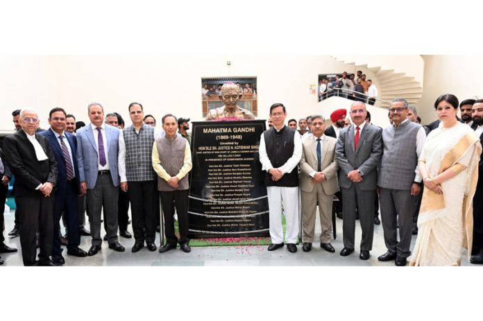 Chief Justice alongwith other Judges of the HC after unveiling bust of Mahatma Gandhi on Tuesday.