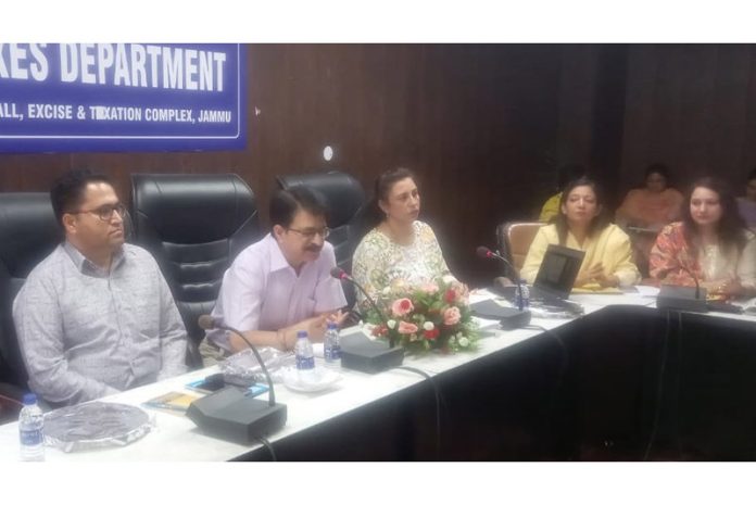 Prediman Krishen Bhat, Commissioner State Taxes Deptt chairing a meeting in Jammu.