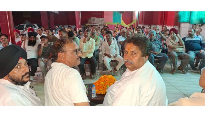 Cong working president Raman Bhalla addressing workers’ convention at Bhour Camp in RS Pura.