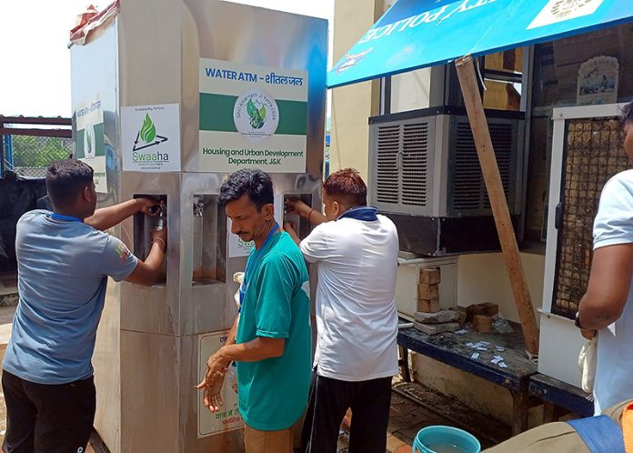 Pilgrims making use of water ATM enroute Amarnath yatra.