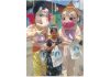 A girl posing with the mascots of Lord Ganesha and Lord Hanuman prepared from recycled waste.