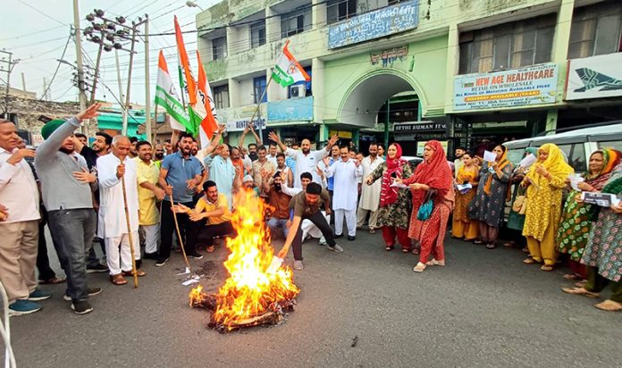 Cong activists staging protest against inflated power bills at Janipur Chowk on Sunday.