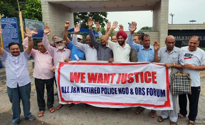 Retired police and fire service personnel staging a demonstration in Jammu on Friday. -Excelsior/Rakesh