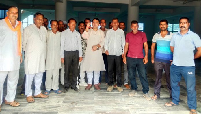 BJP leader, Ranbir Singh Pathania along with others during a public meeting in Udhampur.