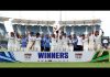 Indian women team posing for group photograph while holding trophy after winning test match against South Africa.