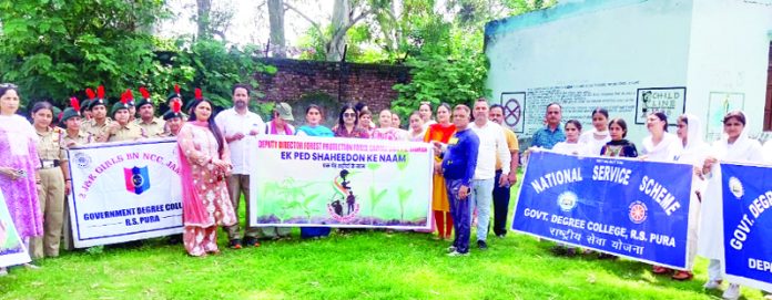 NSS volunteers and NCC cadets of the GDC RS Pura during a program at village Chohala in RS Pura, Jammu.