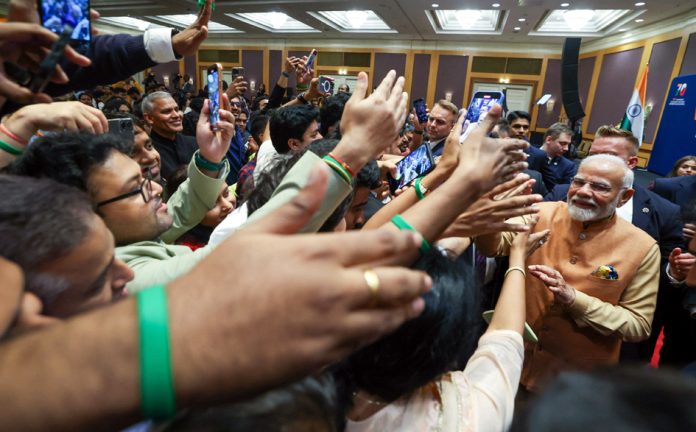 WARSAW, AUG 22 :- Prime Minister Narendra Modi receives warm welcome at Community Event in Warsaw, Poland on Wednesday night. UNI 