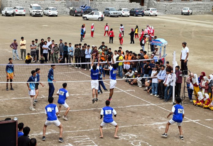 Volleyball players in action during a match at Kargil.