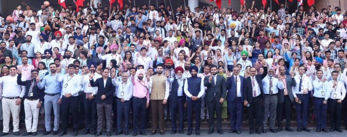 Chancellor of the Chandigarh University with faculty members and students.