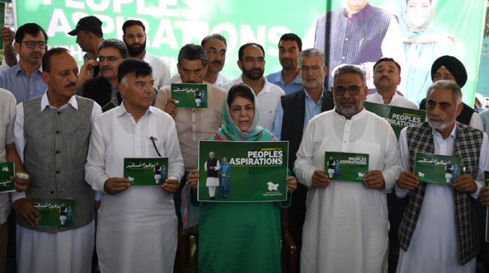 PDP president Mehbooba Mufti along with senior leaders during the release of party’s manifesto in Srinagar on Saturday. -Excelsior/Shakeel