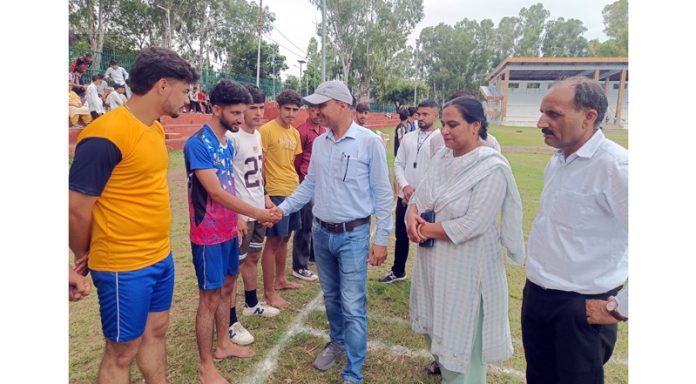 Chief Guest interacting with players before a match in Reasi.