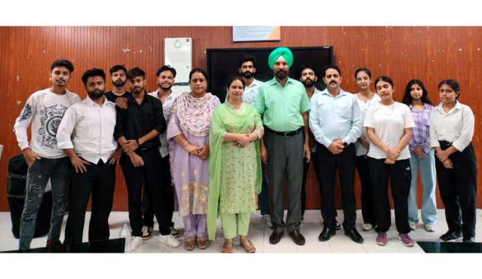 Winners of essay writing competition posing for photograph with Principal and staff of Commerce College.