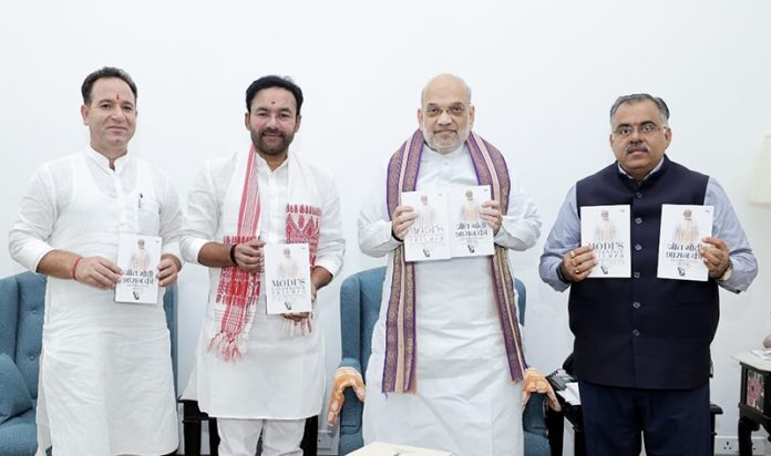 Union Home Minister, Amit Shah and Union Minister of Coal and Mines, G Kishan Reddy releasing Tarun Chugh's book at New Delhi on Saturday.