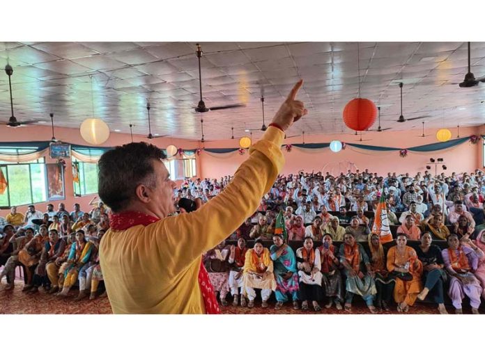 Ravinder Raina addressing Tridev Sammelan in Nowshera Assembly constituency on Monday.