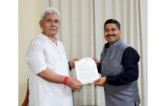 Gaurav Gupta presenting a memorandum of demands to LG Manoj Sinha.