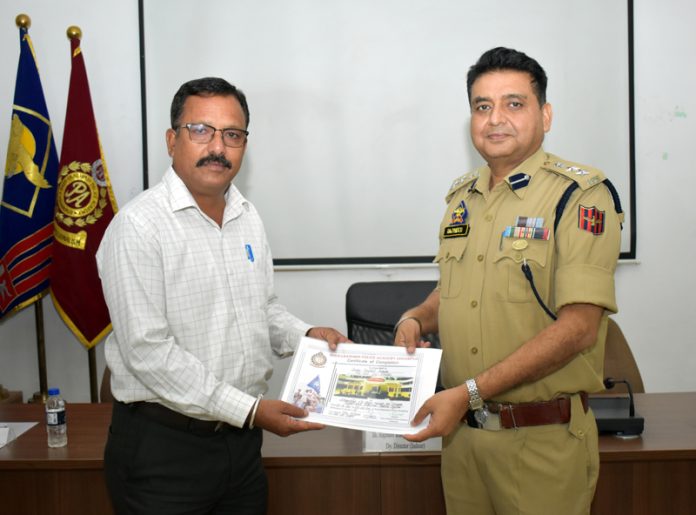 Dy Dir SKPA handing over course certificate to a participant at Udhampur.