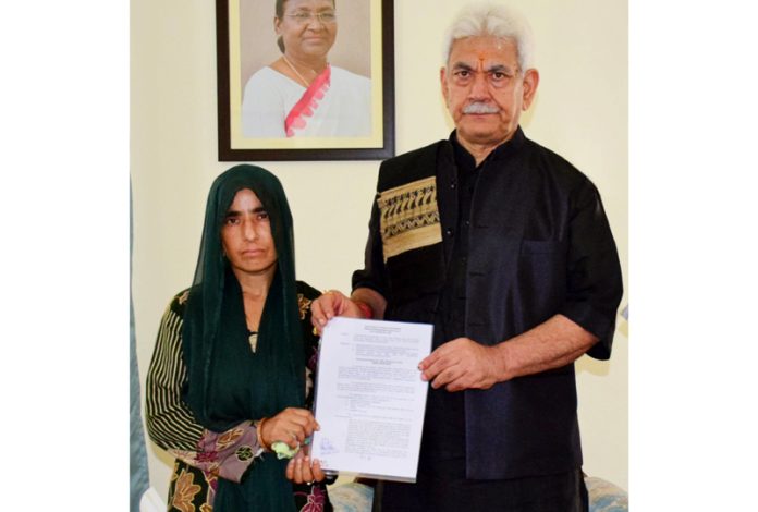 LG Manoj Sinha hands over appointment letter to wife of Reasi terror attack victim.