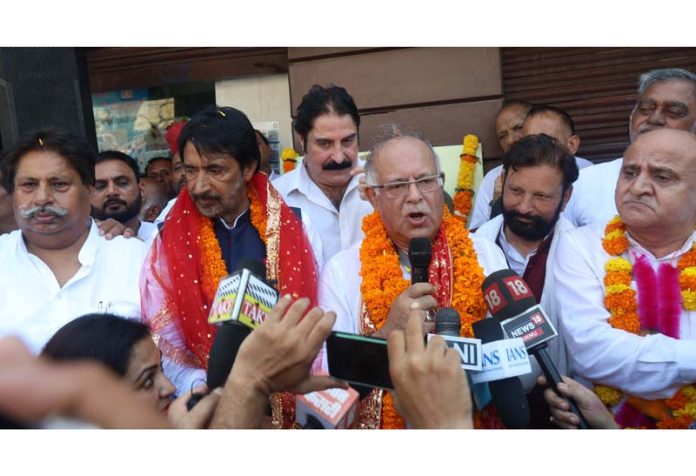 JKPCC president Tariq Hameed Karra flanked by others speaking to mediapersons in Jammu. -Excelsior/Rakesh