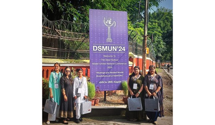 Delegates of Jammu Sanskriti School along with faculty advisor posing during MUN event.