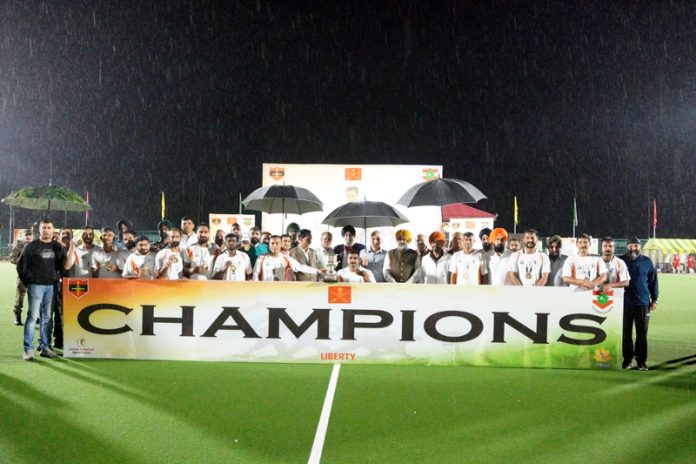 Winning team posing with trophy during the final match at Srinagar.