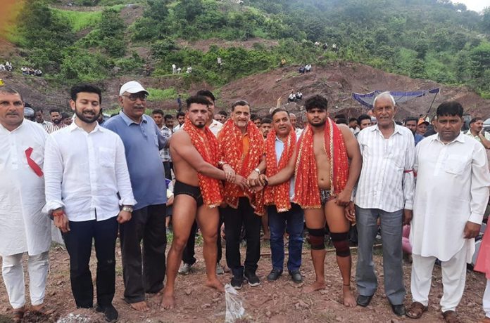 Dignitary introducing wrestlers before Dangal at Kalakote.